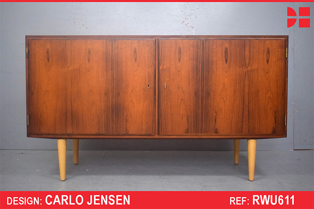 Rosewood cabinet on beech legs designed by Carlo Jensen
