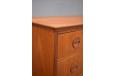 Vintage teak chest of 6 drawers on round tapering legs with solid teak carved handles for sale