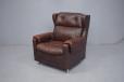 1970s vintage brown leather armchair with high wing back design