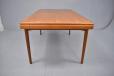 Vintage teak dining table with 2 pull out leaves designed by Arne Hovmand Olsen