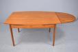 Vinatge teak oval shaped sining table with pull out leaves for sale