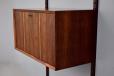 Midcentury rosewood CADO cabinet with locking drop front for sale