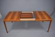 Vintage dining table extending with one self stored leaf designed by Henry W Klein | Model 473