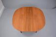 Vintage teak dining table with oval top produced by Danish Cabinet maker in the 1960s