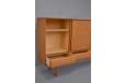 Vintage model 16 teak sideboard with 4 drawers and sliding doors designed by Henry Kjaernulf