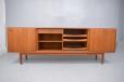 impressively sized vintage teak sideboard with 4 sliding doors by arne hovmand olsen for sale