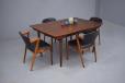 A vintage rosewood dining room that is a statement of elegance in design