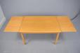 Danish design beech dining table with 2 draw leaves for sale