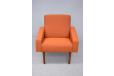 Midcentury armchair in new upholstery on tall teak legs for sale