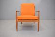 Teak armchair with original sprung cushions produced by France & Daverkosen