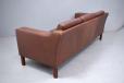 Vintage 3 seater sofa with feather filled cushions upholstered in brown ox leather