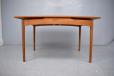 Vintage teak dining table extending with 2 hidden pull out leaves