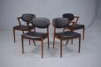 Vintage rosewood framed dining chairs with original black leather upholstery