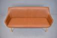 Modern Danish design bench style sofa in brown leather upholstery with shallow frame