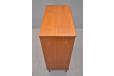 Midcentury design chest of drawers with locking top drawer and carved teak handles for sale