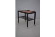 Danish vintage rosewood and black laquered side table on wheels