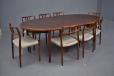 Vintage oval extending dining table with 2 extra leaves in rosewood designed by Arne Vodder model 212 for sibast