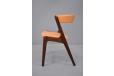 Vintage teak dining chair in orange vinyl upholstery made in the 1960s 