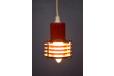 Small industrial style pendant light in red made by Danish Lighting company