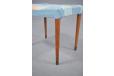 Danish cabinetmaker made teak footstool with brass feet and blue upholstery