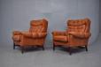 Vintage wingback armchair in orange leather produced by Danish Cabinetmaker