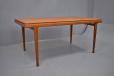 Midcentury Arne Hovmand Olsen design teak dining table with 2 pull out leaves for sale