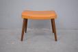 mid century accent footstool with tan vinyl upholstery