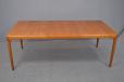 Vintage teak dining table extending with one self stored leaf designed by Henry W Klein | Model 473