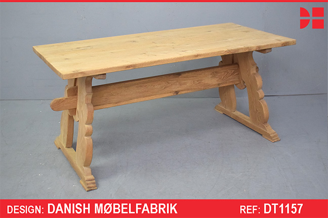 Oak plank table on trestle legs produced by Danish Cabinetmaker