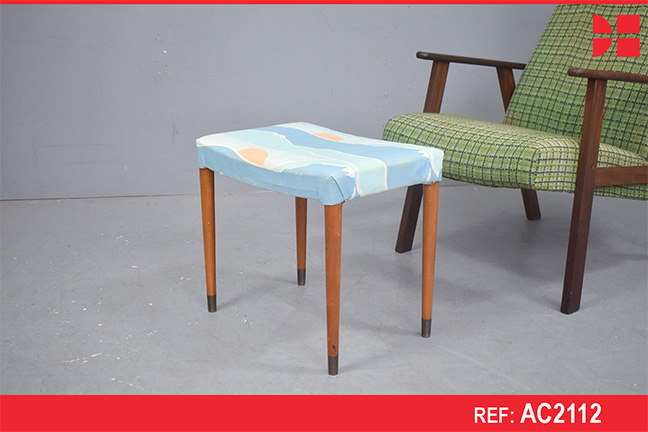 Vintage teak footstool on tall legs with blue upholstery